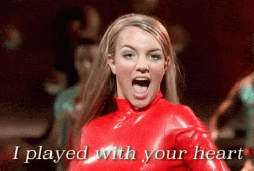 Britney Spears Is Wearing A Red Latex Outfit And Singing I Played With Your Heart . GIF