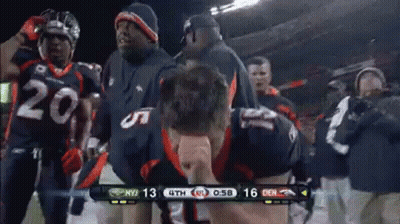 Broncos Football Players Celebrating On Sidelines GIF