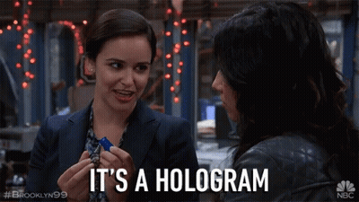 Brooklyn 99 Two Women Talking It's A Hologram GIF