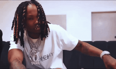 Brown And White Dog With Blue Collar Beside Man GIF