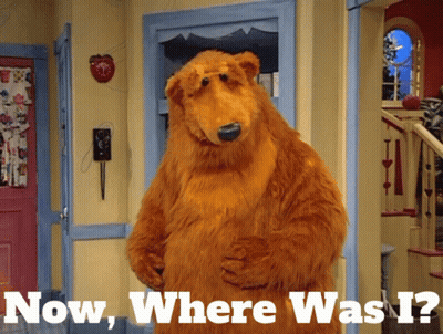 Brown Bear In Hallway Saying Now Where Was I GIF