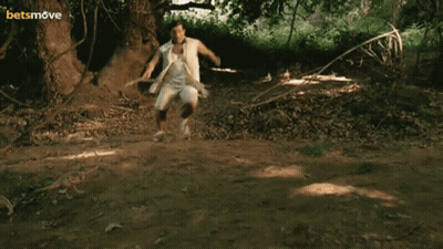 Brown Dog Standing On Hind Legs Behind White Table GIF
