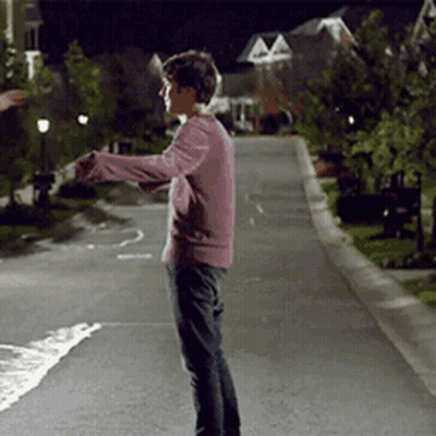Brown Jacket Man Looking At Camera With Woman GIF