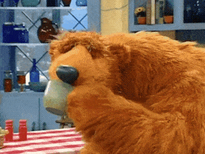 Brown Teddy Bear Drinking Coffee At Table GIF