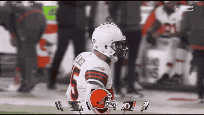Browns Advertisement With Players And Referee GIF