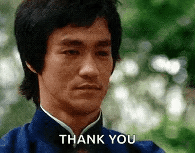 Bruce Lee In Blue Shirt And Bow Tie Saying Thank You GIF