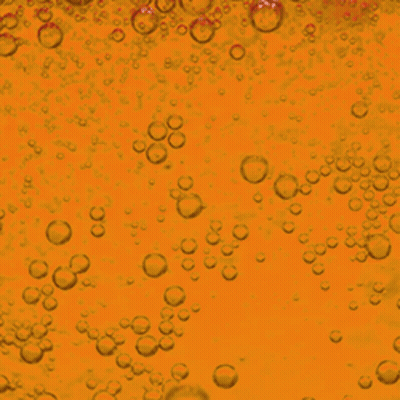 Bubbles Are Floating In A Yellow Liquid GIF