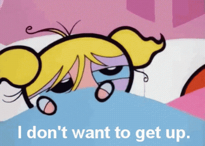 Bubbles From The Powerpuff Girls Is Laying In Bed With The Words I Don 'T Want To Get Up GIF