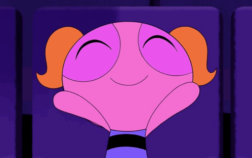 Bubbles From The Powerpuff Girls Is Smiling While Sitting In A Theater Seat GIF