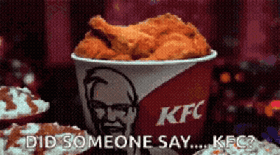 Bucket Of Fried Chicken Next To KFC Sign GIF