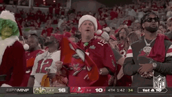 Bucs Fan Wearing Santa Hat Waving Banner GIF