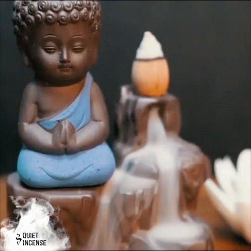 Buddha Statue Next To Waterfall And Incense Burner GIF