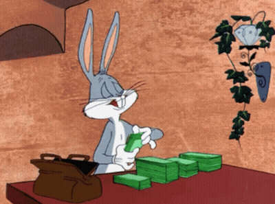 Bugs Bunny At Table With Money And Briefcase GIF