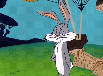 Bugs Bunny From Looney Tunes Is Standing In A Field GIF