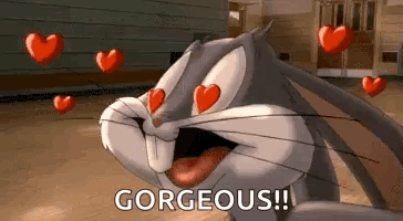 Bugs Bunny From Looney Tunes Is Surrounded By Hearts And Says Gorgeous . GIF