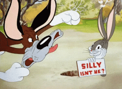 Bugs Bunny Holding Sign Saying Silly Isn't He GIF