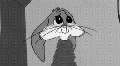 Bugs Bunny Is Crying In A Black And White Cartoon While Holding A Spring . GIF