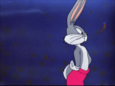 Bugs Bunny Is Flexing His Muscles In A Cartoon GIF