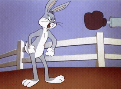 Bugs Bunny Is In A Boxing Ring With A Boxing Glove GIF