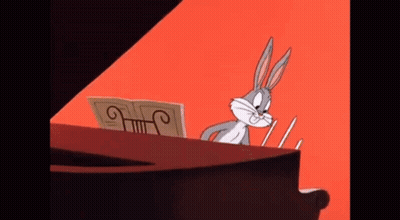 Bugs Bunny Is Playing A Piano With A Sheet Of Music GIF