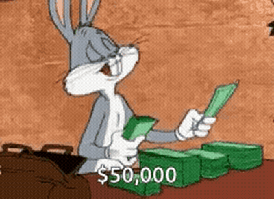 Bugs Bunny Is Sitting At A Table Holding A Bunch Of Money In His Hands . GIF
