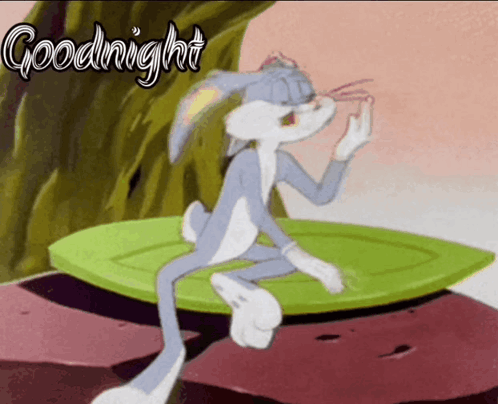 Bugs Bunny Is Sitting On A Leaf With The Words Goodnight Written Above Him GIF