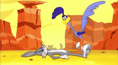 Bugs Bunny Lying Down Coyote Standing Over GIF
