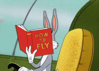 Bugs Bunny Reading Book How To Fly GIF