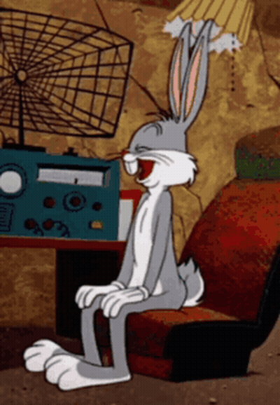 Bugs Bunny Sitting In Chair With Open Mouth GIF