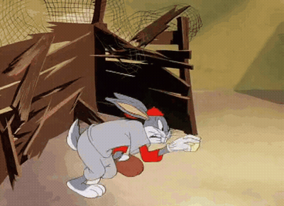 Bugs Bunny Standing In Front Of Wooden Fence Holding Bowl Of Food GIF