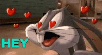 Bugs Bunny Surrounded By Flying Hearts GIF