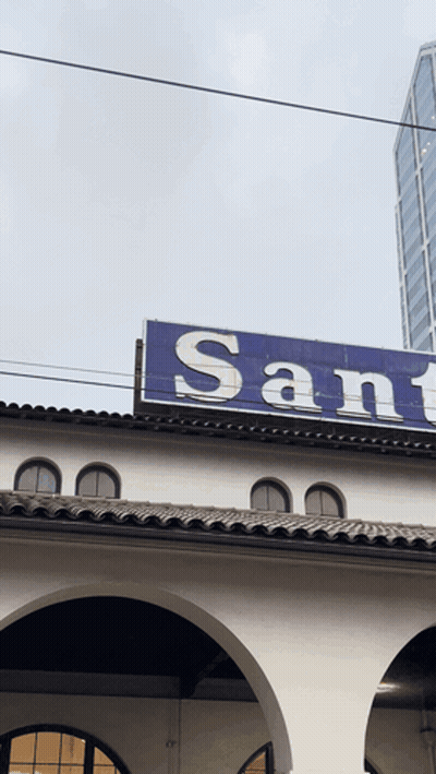 Building With Blue Sign Saying Sant GIF