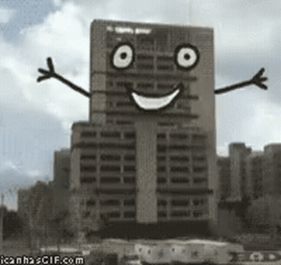 Building With Face Arms And Legs GIF