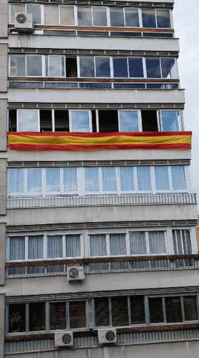 Building With Red And Yellow Flag GIF