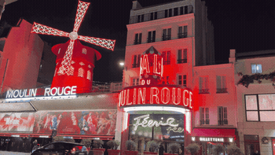 Building With Red Moulin Rouge Sign GIF