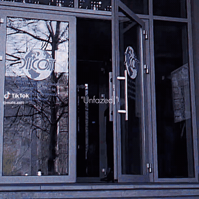 Building With Unfazed Sign GIF