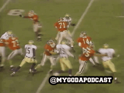 Bulldog On Leash Walking Football Field In Red Jersey GIF