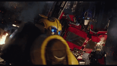 Bumblebee And Optimus Prime Flying Through Air GIF