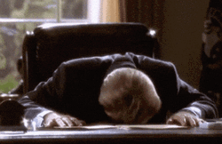 Bumping Head Onto Desk GIF