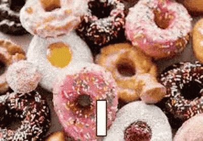 Bunch Of Donuts With Sprinkles Stacked GIF