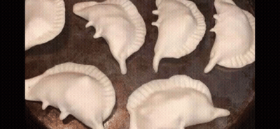 Bunch Of Dumplings Stacked On Pan GIF