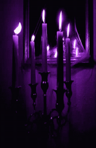 Bunch Of Lit Candles In Dark Room GIF