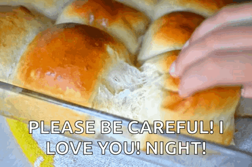 Bunch Of Rolls In Pan With Love Message GIF