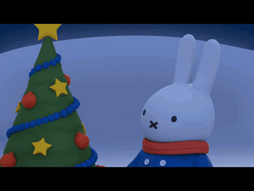 Bunny With Scarf In Front Of Christmas Tree GIF