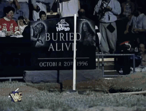 Buried Alive Sign In Crowd GIF