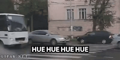 Bus Driving Beside Car And Building GIF
