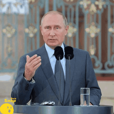 Businessman At Podium With Two Microphones And Water GIF