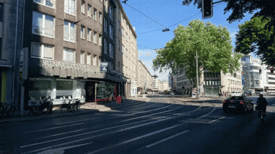 Busy City Street With Avonals Lounge Building