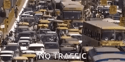Busy City Street With Cars And Buses Saying No Traffic GIF