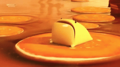 Butter Stirred In Frying Pan With Red Spatula GIF